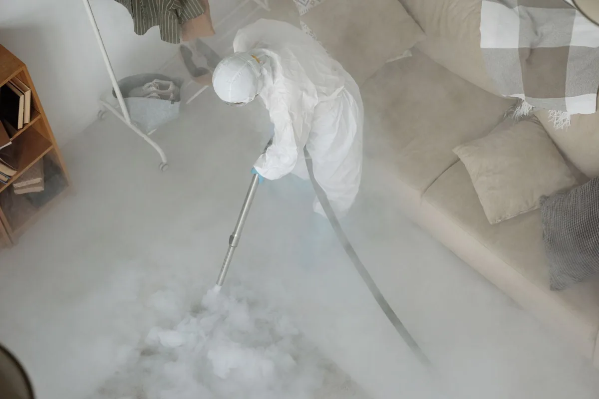 Biohazard cleanup technician in protective equipment, Merritt, Oakland, CA